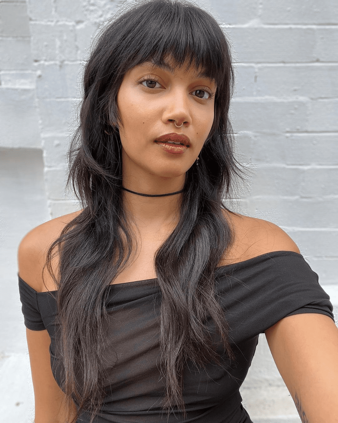 Effortlessly Chic Modern Shag Hairstyle with Cheeky Fringe
