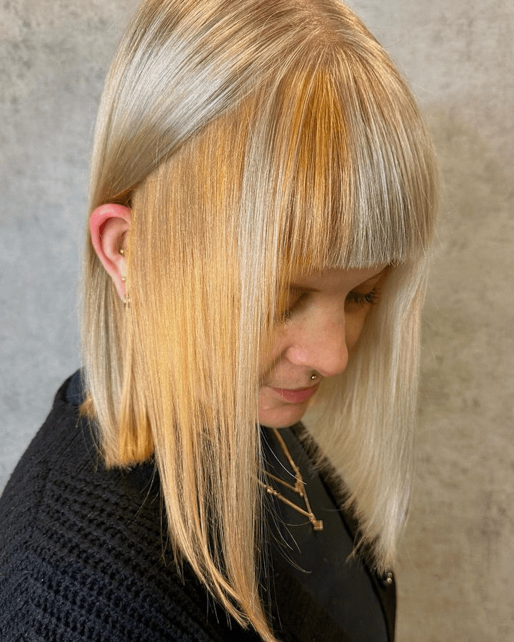 Bold And Vibrant The Edgy Blunt Bob With Honey Blonde Highlights Is The Must Have Hairstyle For 2024 