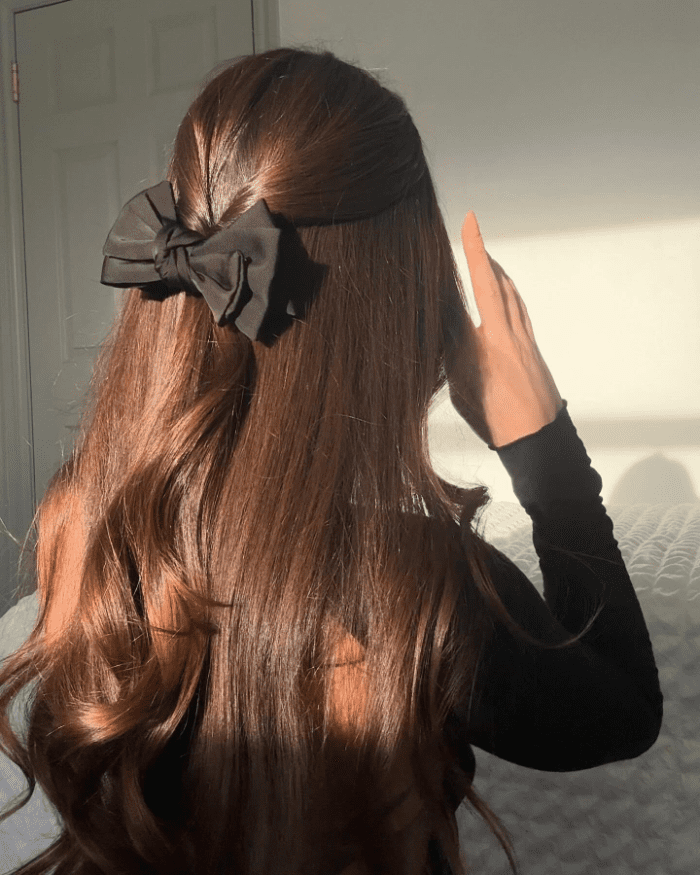 Cascading Curls with Bold Ribbon
