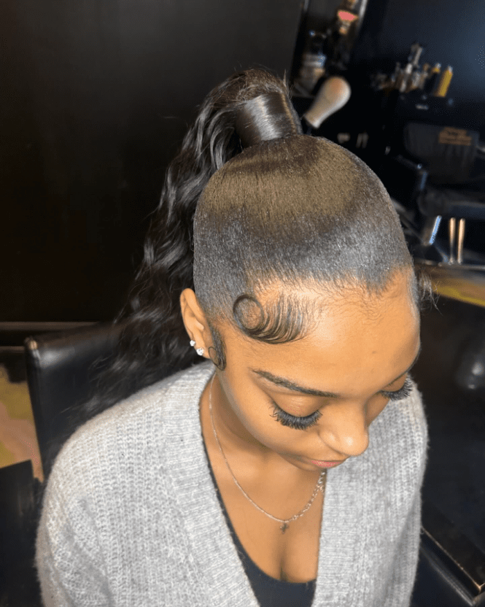 Chic High Ponytail with Playful Waves