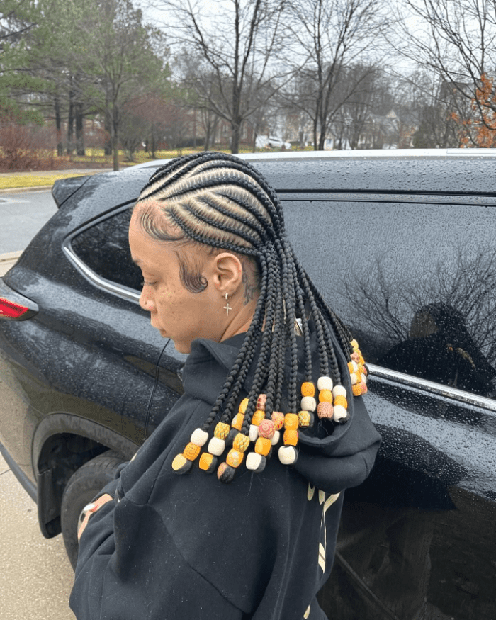 Sleek Knotless Braids with Gold and Wooden Bead Accents