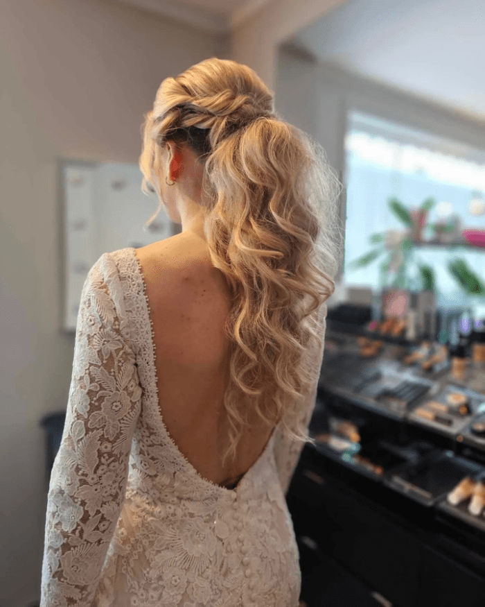 Soft Bridal Curls with Delicate Updo and Braided Charm