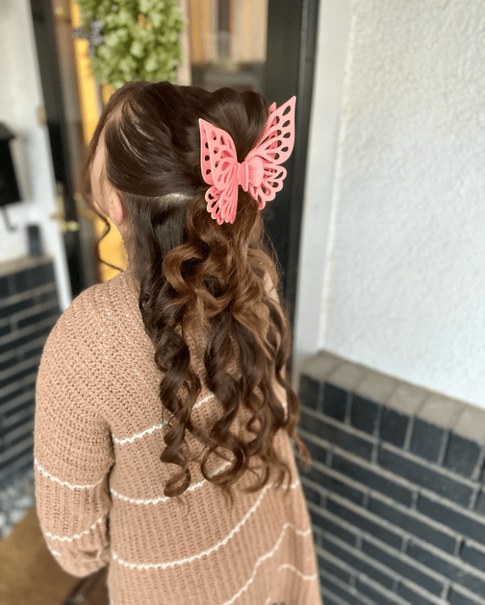 Butterfly Elegance in Curls
