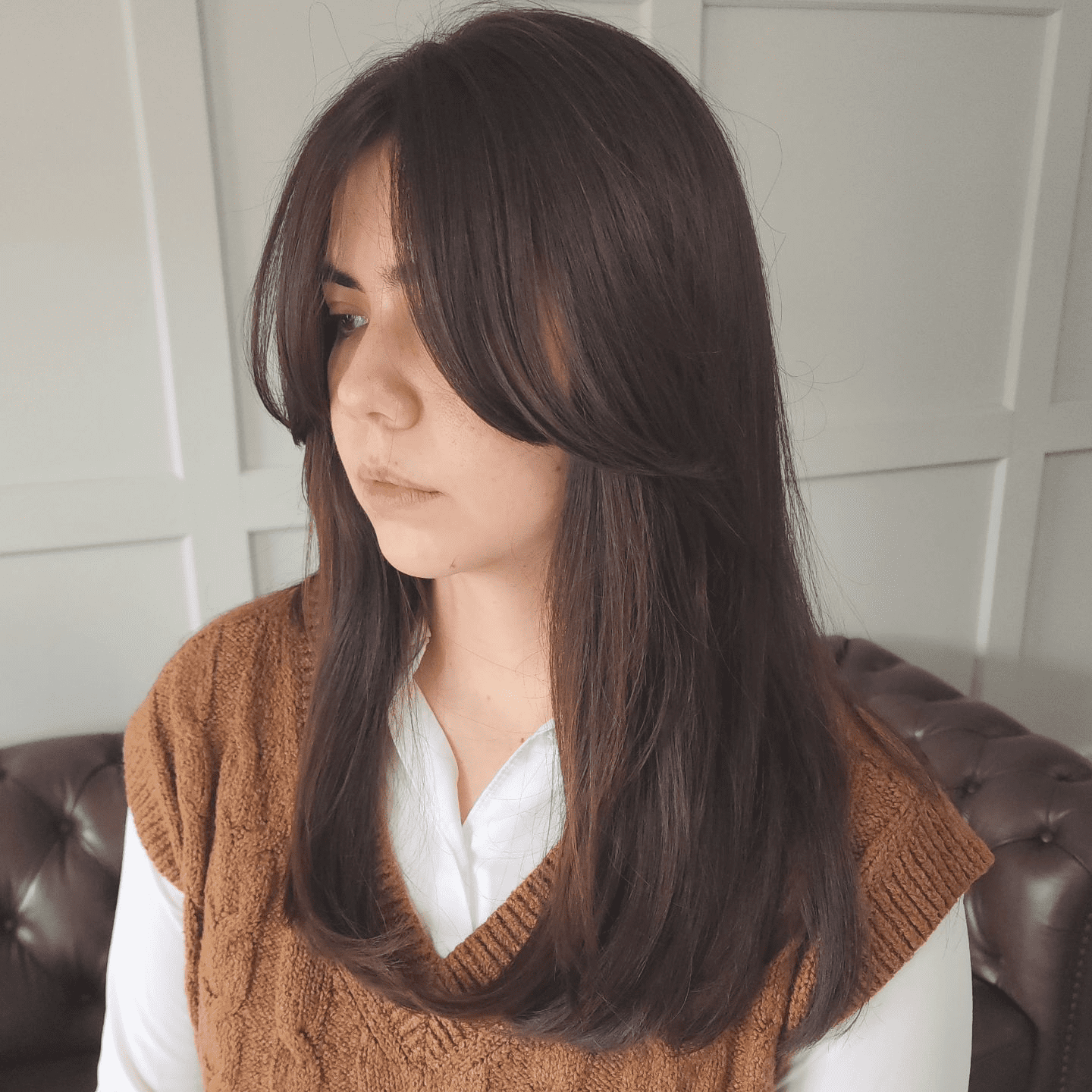 Messy Layers and Side-Swept Bangs in Deep Brown
