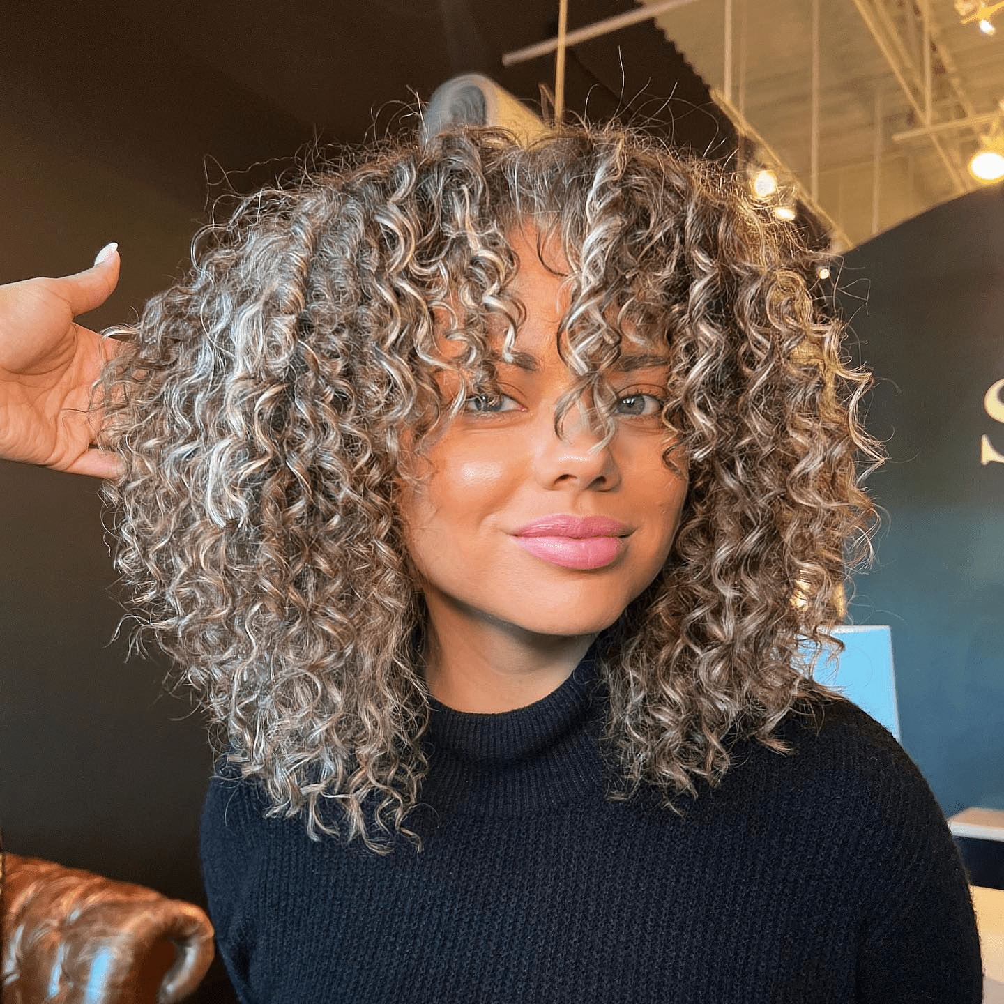 Shoulder-Length Curls with Face-Framing Layers